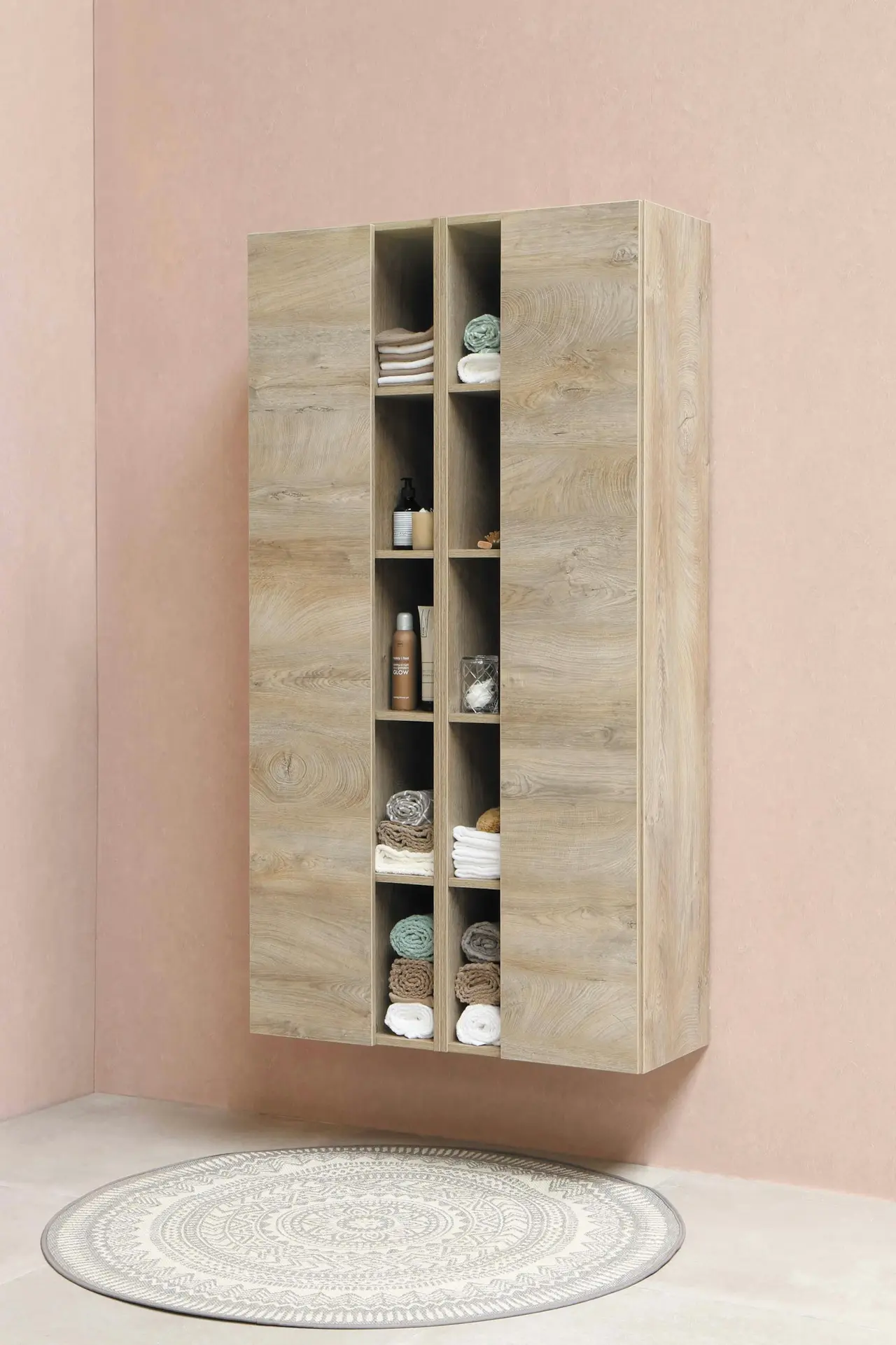 A slim wall-mounted cubby shelf storing folded items
